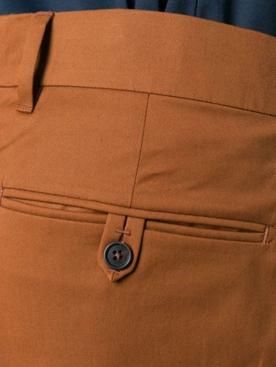 Shop Prada Pleated Bermuda Shorts In Brown