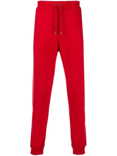 Shop Versace Tapered Joggers In Red