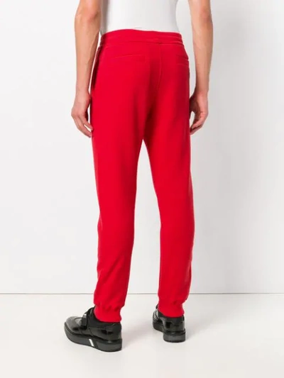 Shop Versace Tapered Joggers In Red