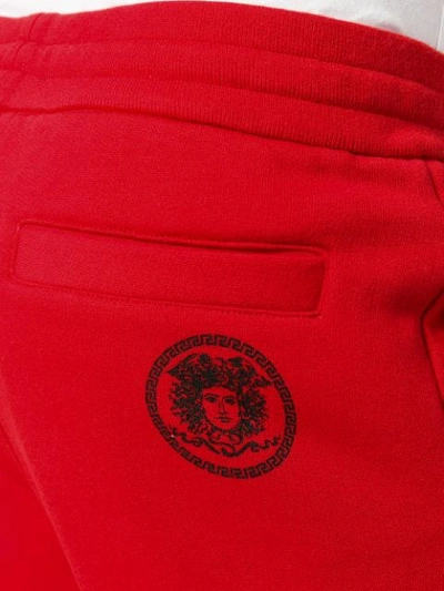 Shop Versace Tapered Joggers In Red