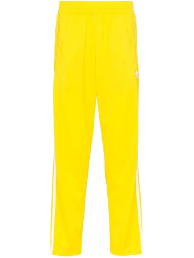 Shop Adidas Originals Striped Track Pants In Yellow