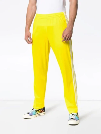 Shop Adidas Originals Striped Track Pants In Yellow