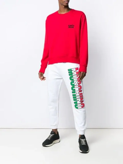 Shop Moschino Couture! Logo Print Track Pants In White