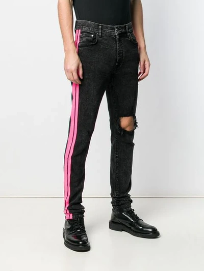 Shop Amiri Stripe Skinny Jeans - Black