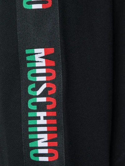 Shop Moschino Logo Band Hoodie In Black