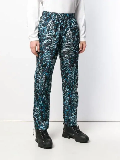 Shop Palm Angels Pine Camouflage Print Trousers In Blue