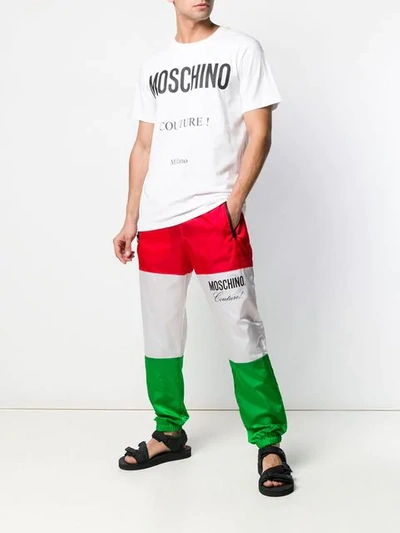 Shop Moschino Logo Print Track Pants In Red