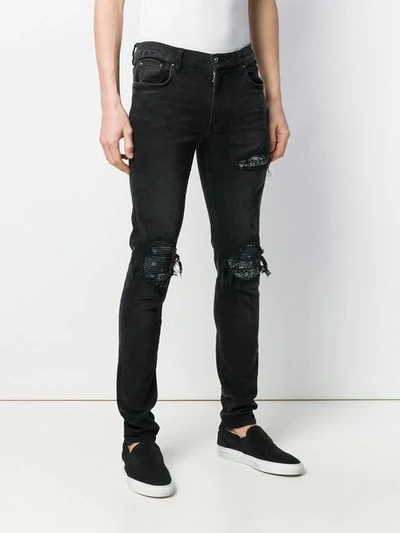 Shop Amiri Ripped Skinny Jeans In Black