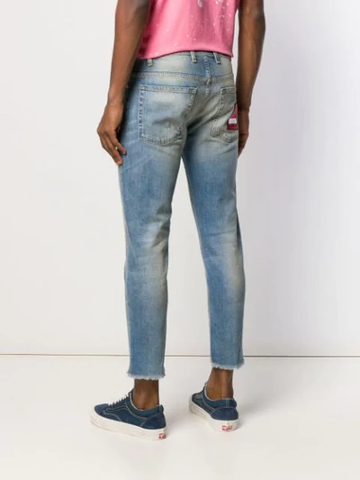 Shop Represent Patchwork Distressed Jeans In Blue