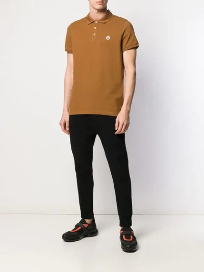 Shop Moncler Logo Patch Polo Shirt In Brown