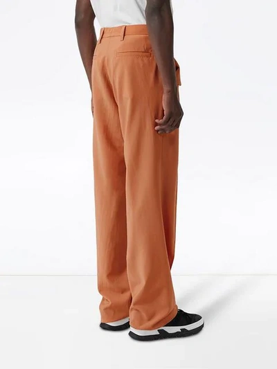 Shop Burberry Buttoned Wide-leg Trousers In Orange