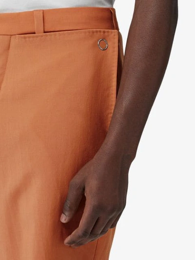 Shop Burberry Buttoned Wide-leg Trousers In Orange
