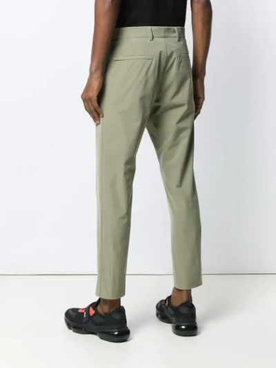 Shop Prada Technical Fabric Trousers In Green