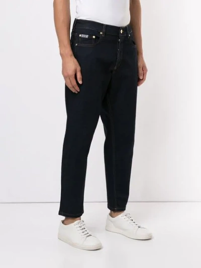 Shop Versace Jeans Tapered Jeans - Blue