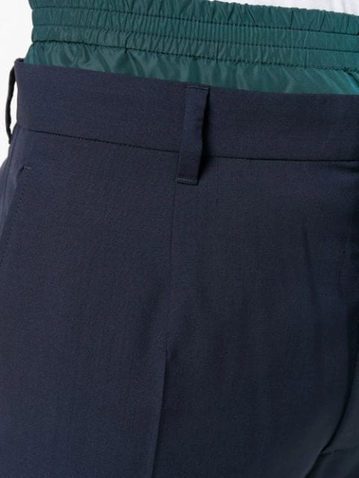 Shop Prada Techno Waist Detail Trousers In Blue
