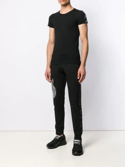 Shop Plein Sport Logo Embellished Trousers In Black