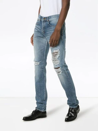 Shop Saint Laurent Distressed Slim-fit Jeans In Blue