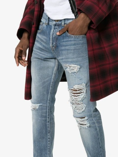 Shop Saint Laurent Distressed Slim-fit Jeans In Blue