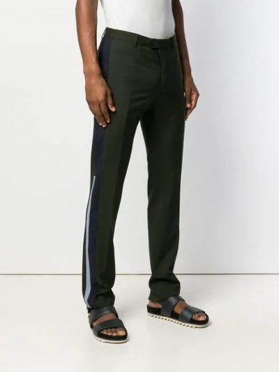 Shop Valentino Side Stripe Trousers In Green