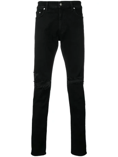 Shop Represent Ripped Skinny Jeans In Black