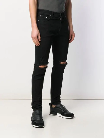 Shop Represent Ripped Skinny Jeans In Black