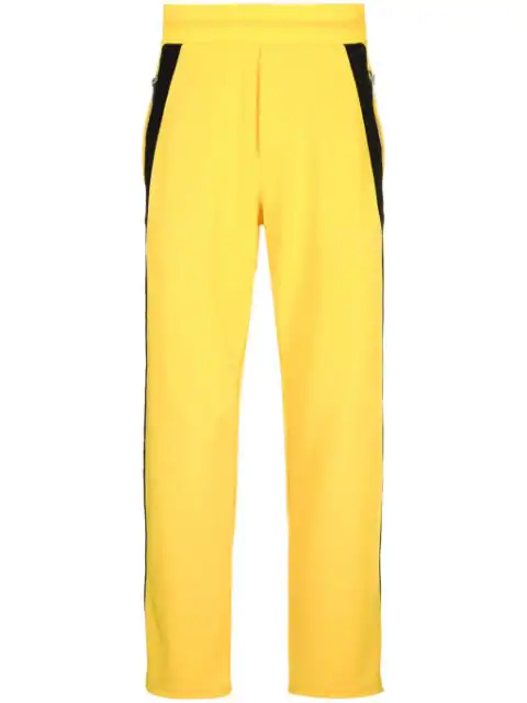 yellow pants with black side stripe