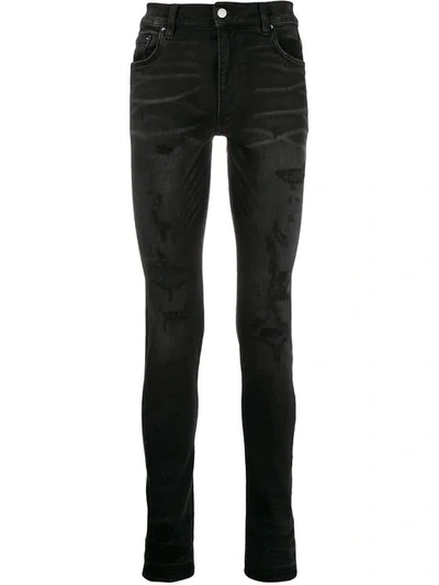 Shop Amiri Distressed Skinny Jeans - Black