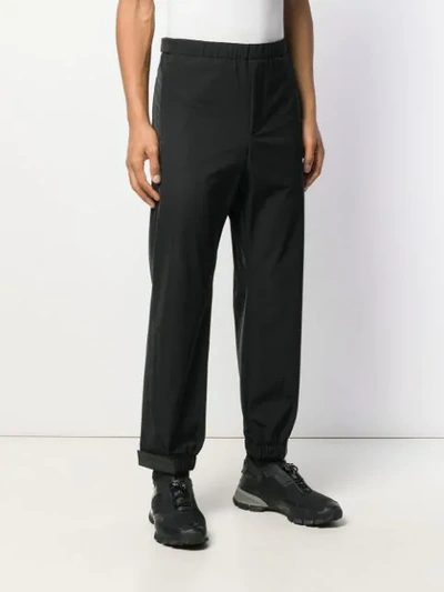 Shop Prada Ankle Strap Logo Trousers In Black