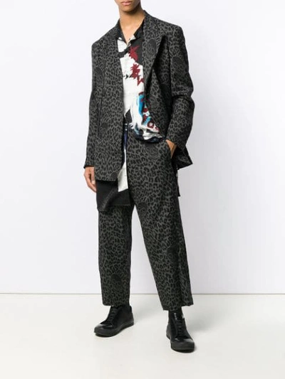Shop Yohji Yamamoto Leopard Print Trousers In Black