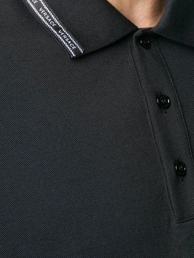 Shop Versace Logo Trim Polo Shirt In Black
