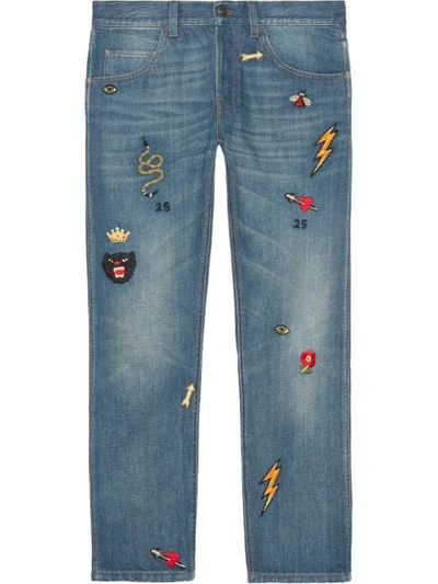 Shop Gucci Tapered Denim Pant With Symbols In Blue