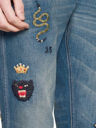 Shop Gucci Tapered Denim Pant With Symbols In Blue