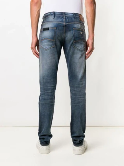 Shop Emporio Armani Regular Bootcut Jeans - Blue