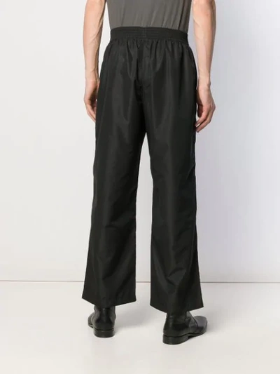 Shop Our Legacy Flared Trousers In Black