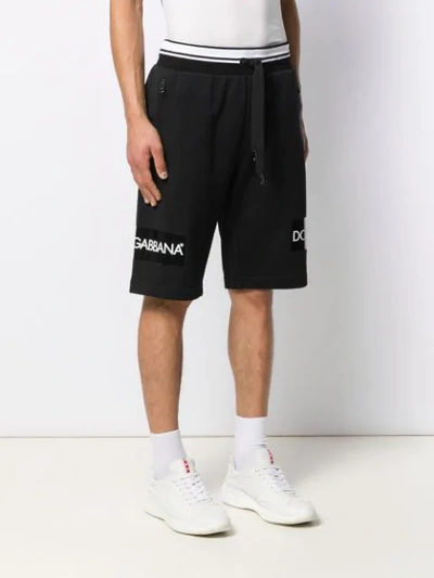 Shop Dolce & Gabbana Logo Print Bermuda Shorts In Black