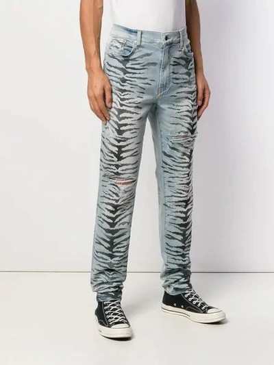 Shop Amiri Tiger Destruction Jeans In Blue