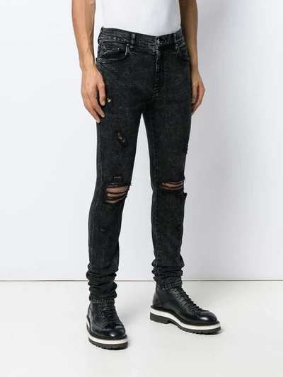 Shop Amiri Distressed Skinny Jeans In Black