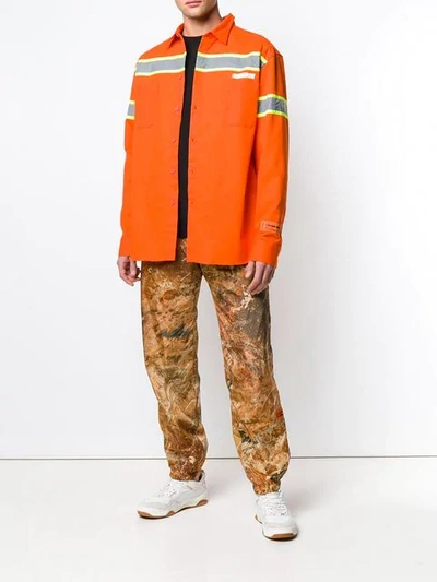 Shop Heron Preston Camouflage Print Track Trousers In Orange