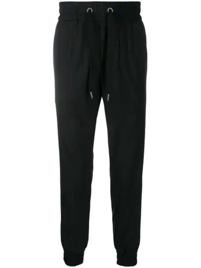 Shop Dolce & Gabbana Tapered Track Trousers In Black