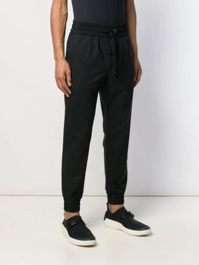 Shop Dolce & Gabbana Tapered Track Trousers In Black