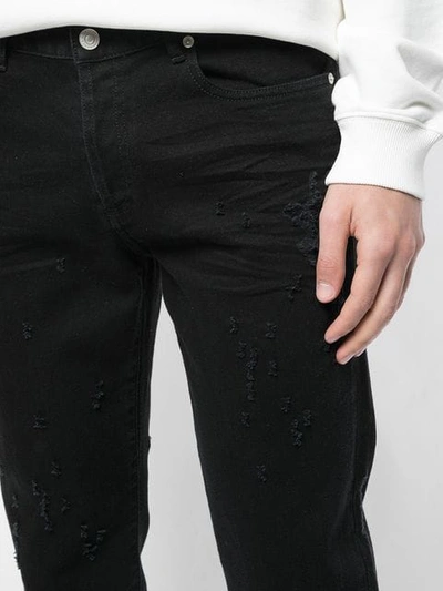 Shop Givenchy Destroyed Skinny Jeans In Black
