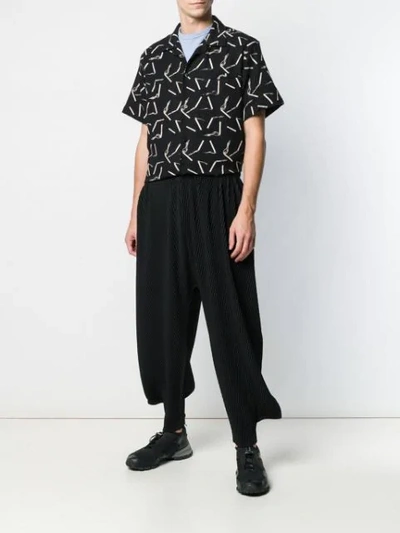 Shop Issey Miyake Cropped Pleated Trousers In Black