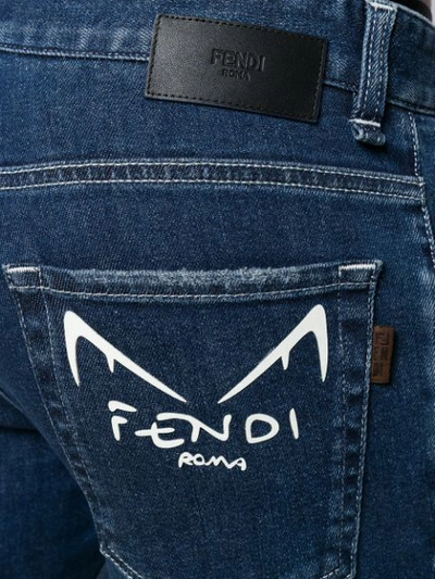 Shop Fendi Diabolic Eyes Slim-fit Jeans In Blue