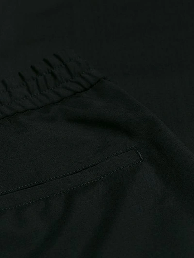 Shop Versace Elasticated Waist Track Pants In Black