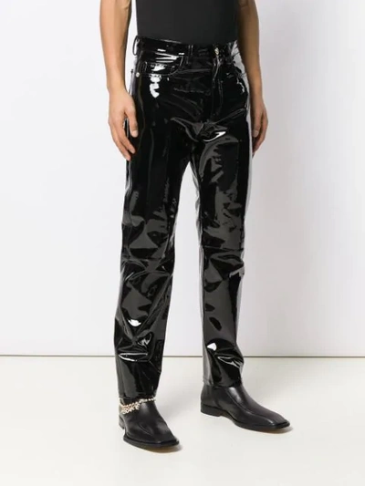 Shop Versace Embellished Leather Trousers In Black