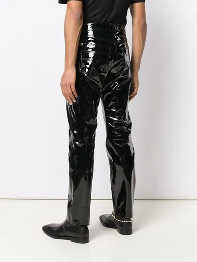 Shop Versace Embellished Leather Trousers In Black