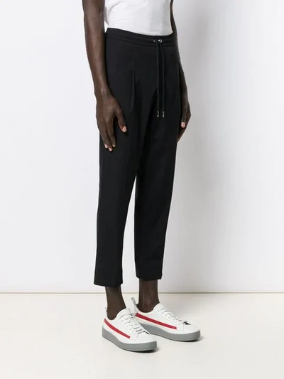 Shop Moncler Drawstring Cropped Trousers In Black