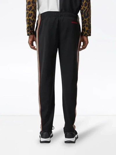 Shop Burberry Icon Stripe Detail Jersey Trackpants In Black