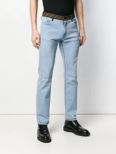 Shop Fendi Logo Banded Slim Jeans In Blue