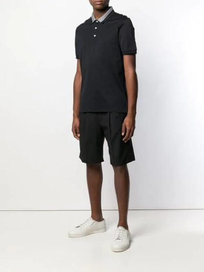 Shop Ferragamo Patterned Collar Polo Shirt In Black